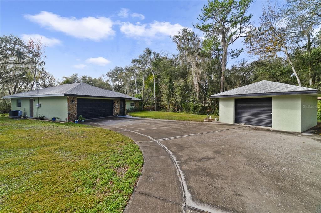 This home delivers an attached 2-CAR GARAGE that houses your laundry and a bonus detached 1-CAR GARAGE for additional parking, storage or workshop space!