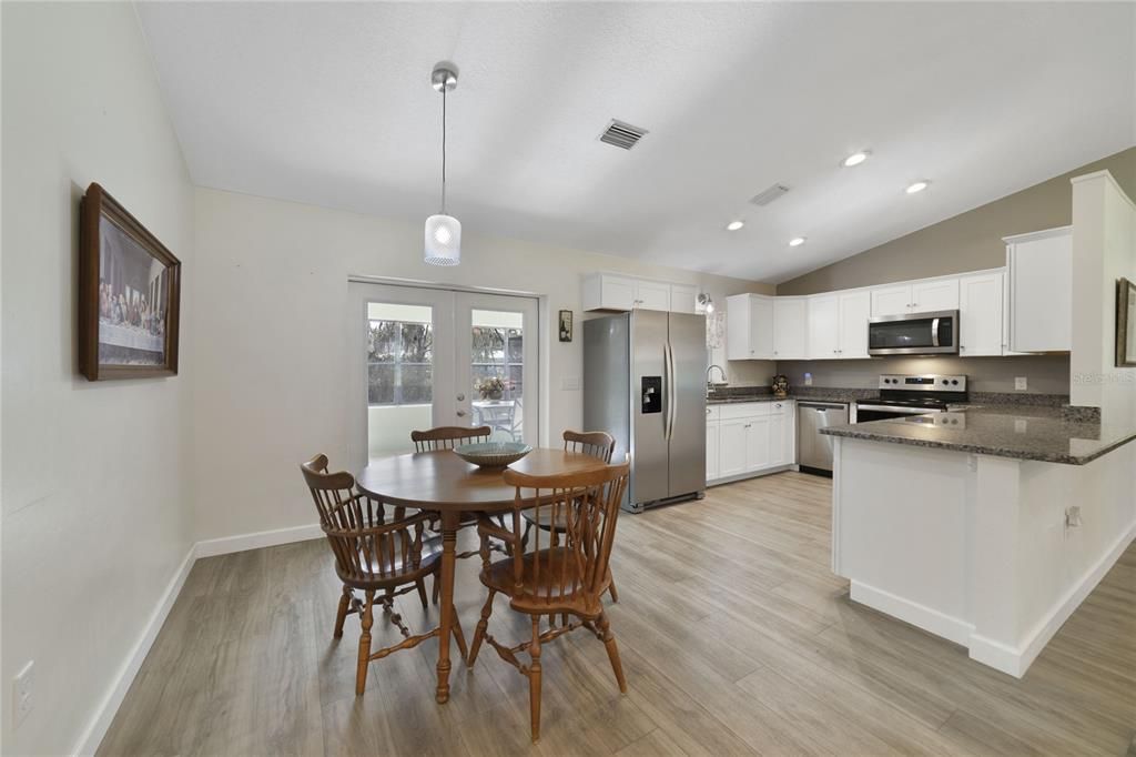 The family chef will appreciate the comfortable layout of the kitchen open to both the living and dining areas to entertain friends and family with ease featuring STAINLESS STEEL APPLIANCES, ample storage in the modern SHAKER STYLE CABINETRY, and breakfast bar for casual dining!