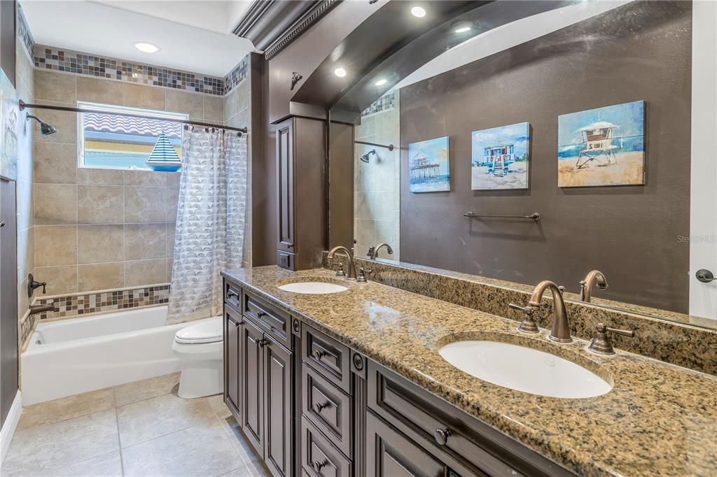 Guest bathroom with dual sinks.