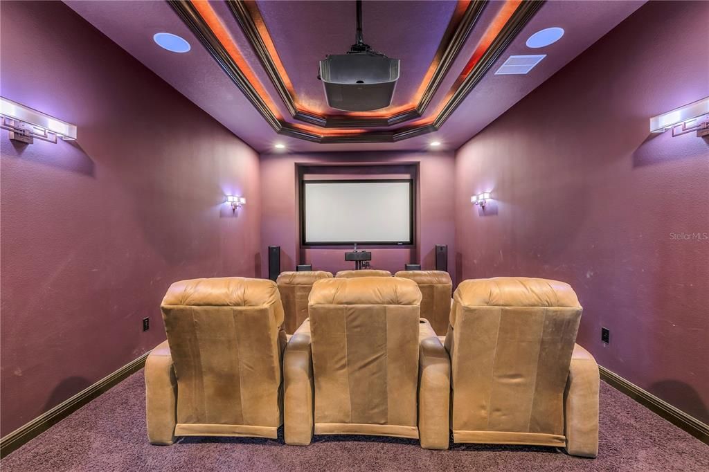 Comfortable media room with large screen.