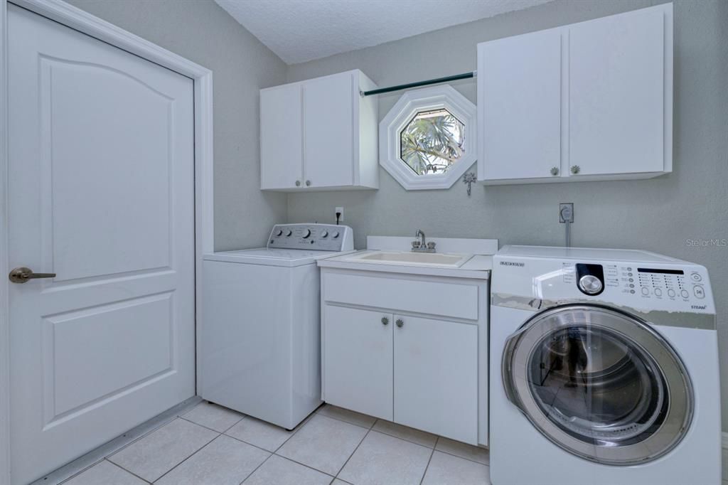 Laundry Room with Sink and Storage Cabinets