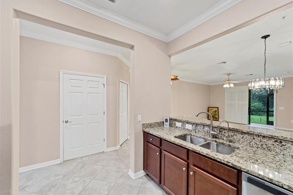 Kitchen Shows Door to 1/2 Bath