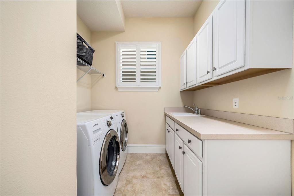 Spacious laundry room with sink