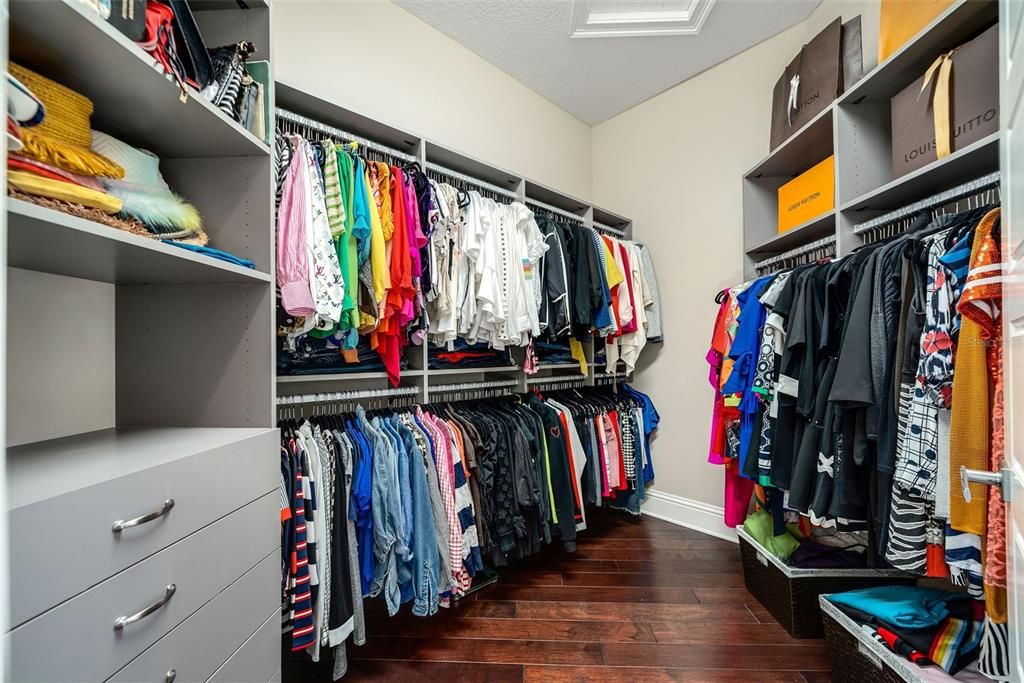 Custom built closet system in primary and all closets