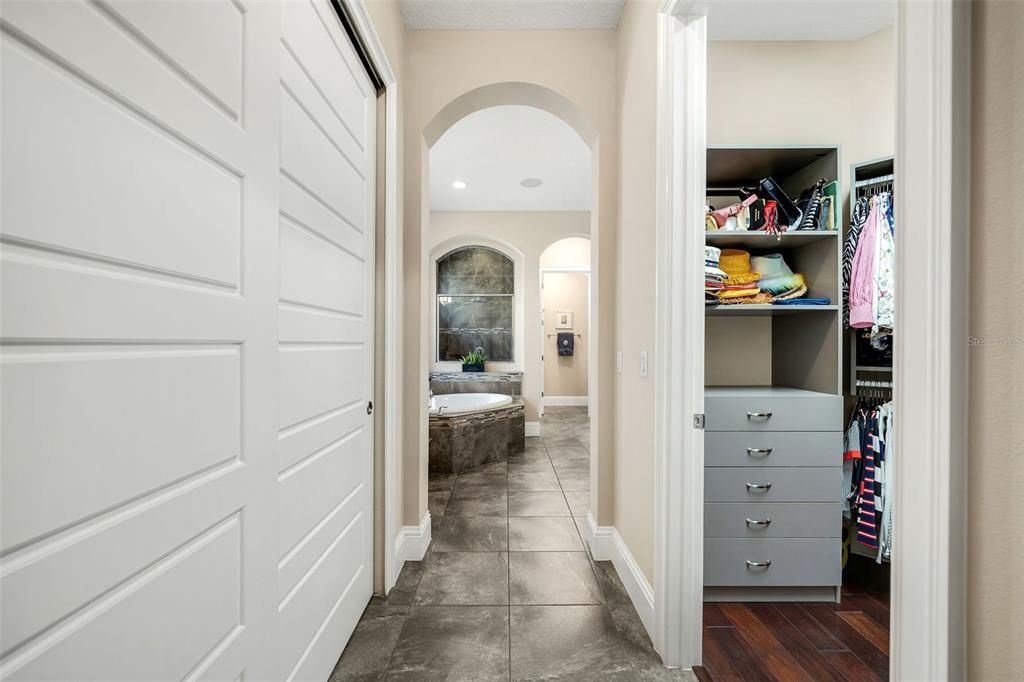 Primary closets and bathroom