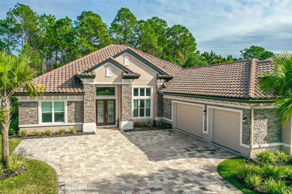 Pavers Driveway Leads to 3 Car Garage