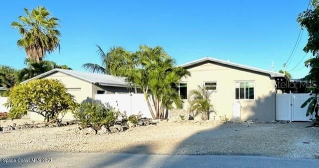 Street view with 5 parking spaces including RV parking with electric, water and sewer hook up!