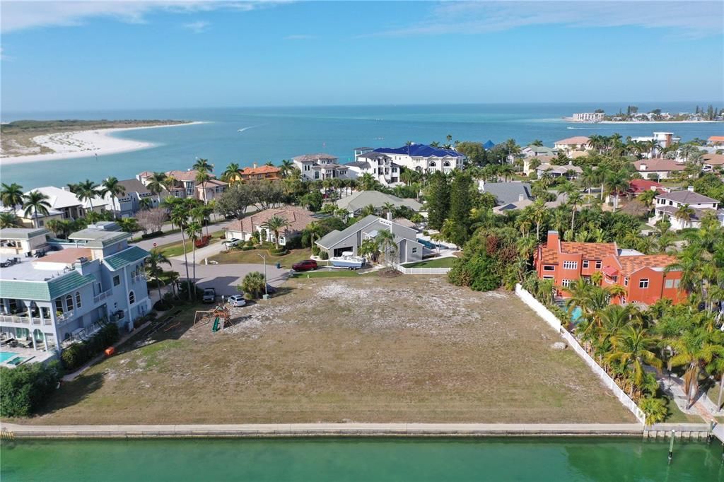 Aerial view- showing close access to the Gulf of Mexico. Lot for sale is adjacent to the long fence and back fence
