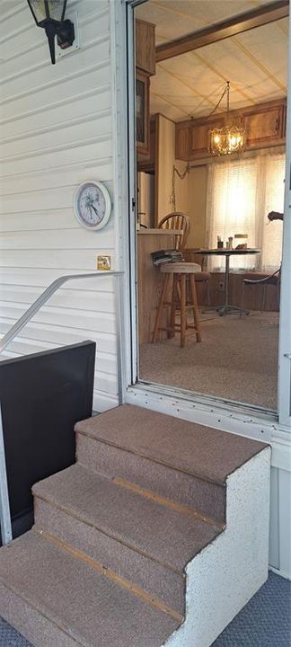 STEPS INTO LIVING ROOM & KITCHEN