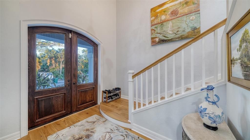 Foyer entrance with antique double wood and glass doors