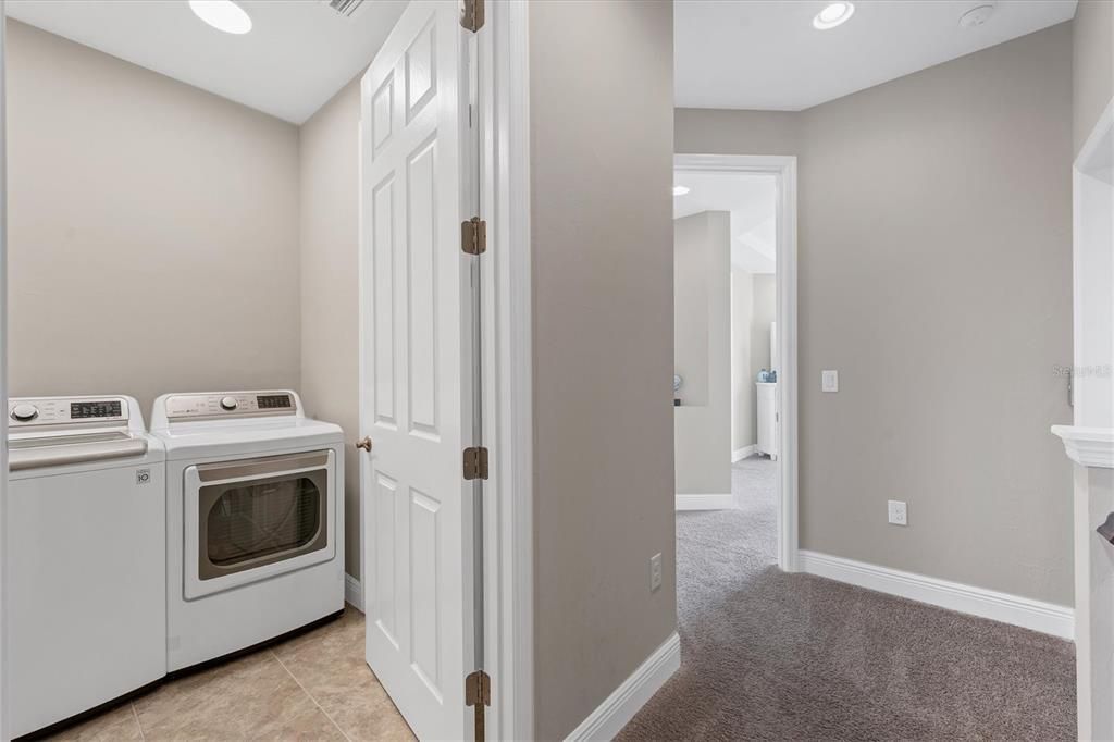 Laundry Room is located on upper level along with both Master Suites