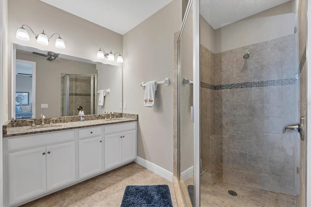 2nd Master Suite Bath features dual sinks & a walk-in shower