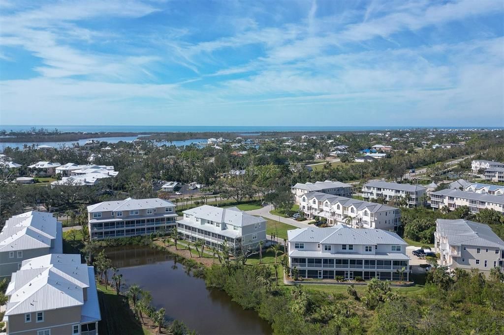 Aerial views overlooking pond with close proximity to the Intracoastal & Gulf of Mexico in the distance