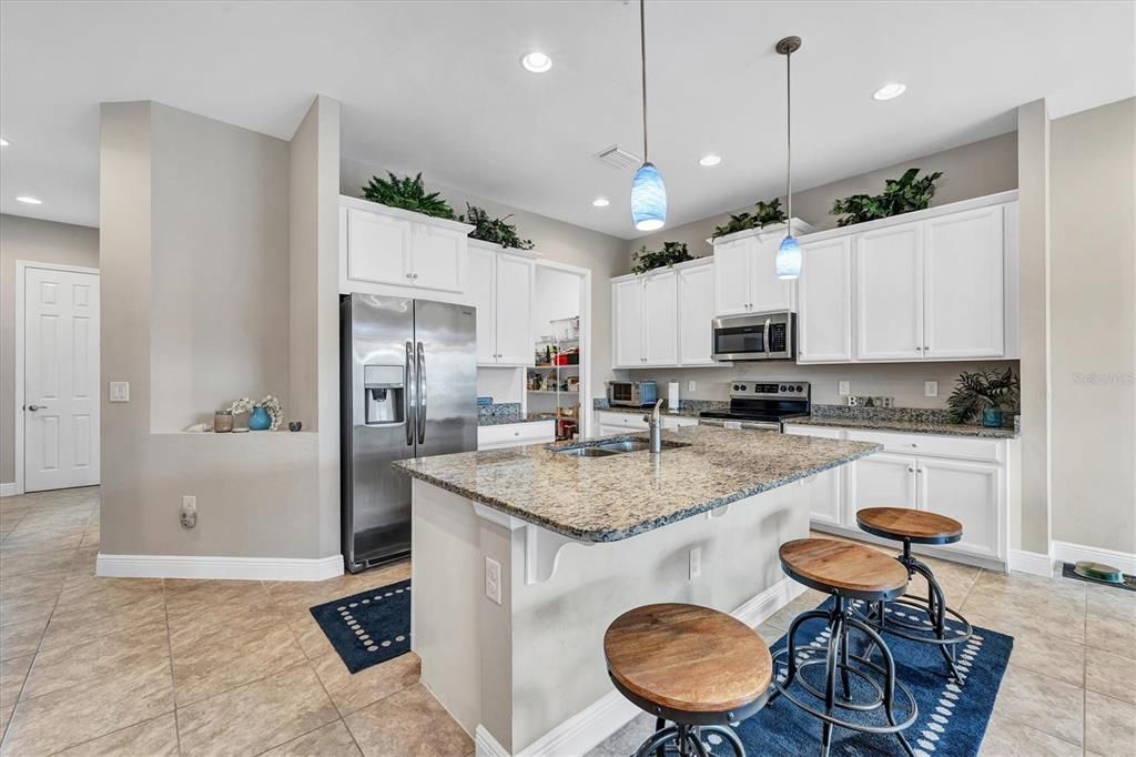 Spacious kitchen is complimented with granite & stainless appliances