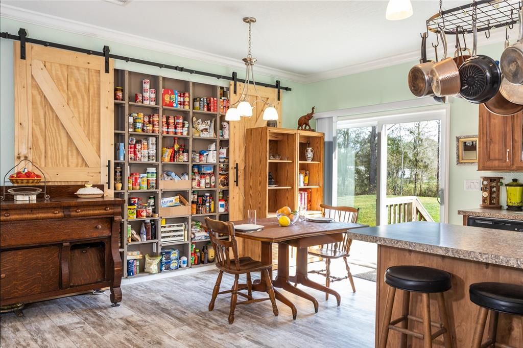 lovely built-in pantry with barn doors