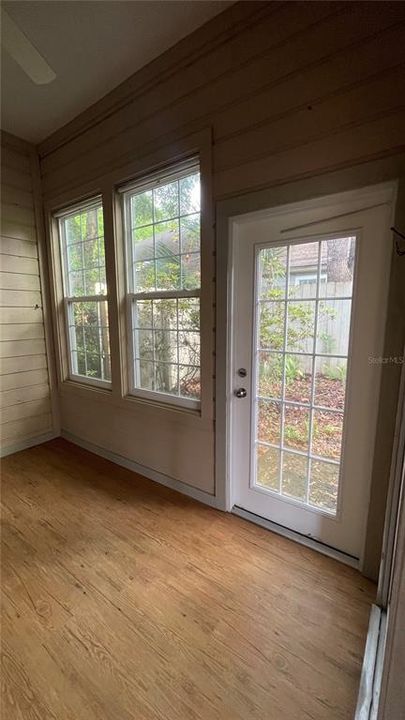 Enclosed Porch with Access to Backyard