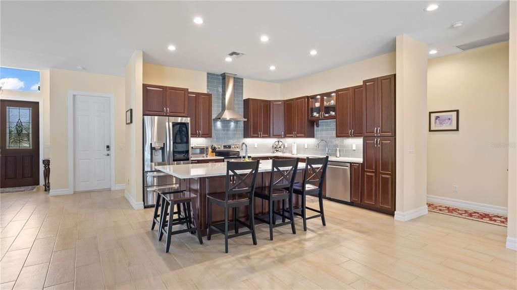 Kitchen - All upgraded stainless steel appliances including below counter microwave. Beautiful subway tile backsplash and multiple sinks with upgraded faucets!