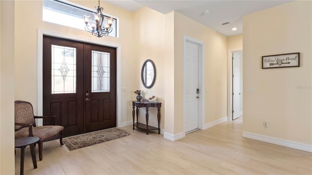 Entry - Beautiful double door entry into a wide open floor plan that is open, airy and customized in every direction! All tile flooring throughout the home, neutral paint palette -clean, straight lines and lots of attention todetails!