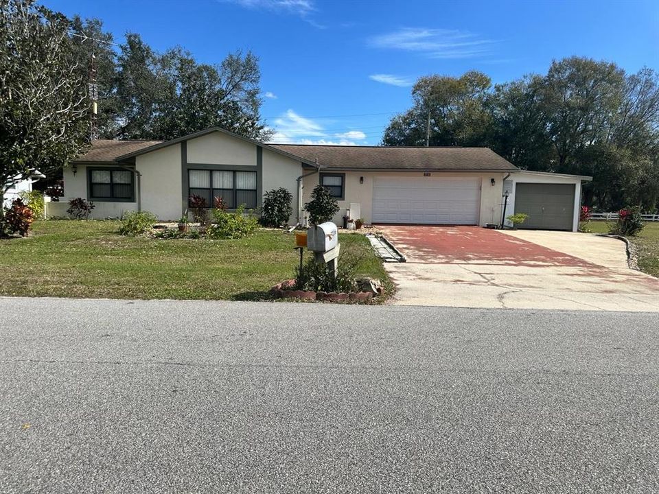 Front of Home with Storage Workshop