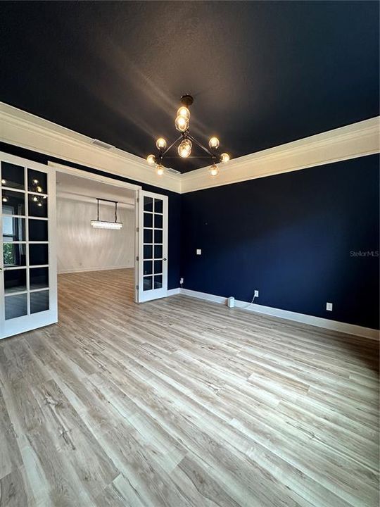 Office/Den with updated light-wood flooring