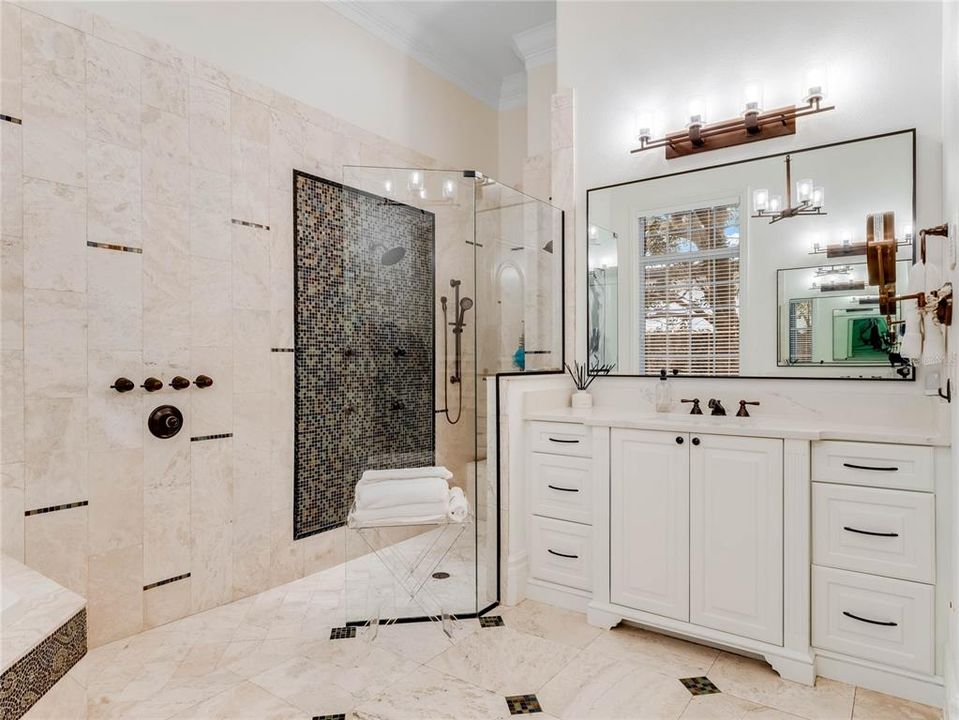 Primary bathroom with double vanities,garden tub and spacious separate shower.
