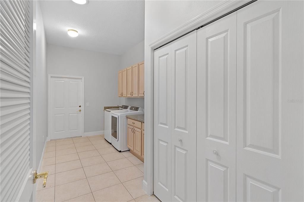 Laundry Room with Large Closet & Entry to the Garage