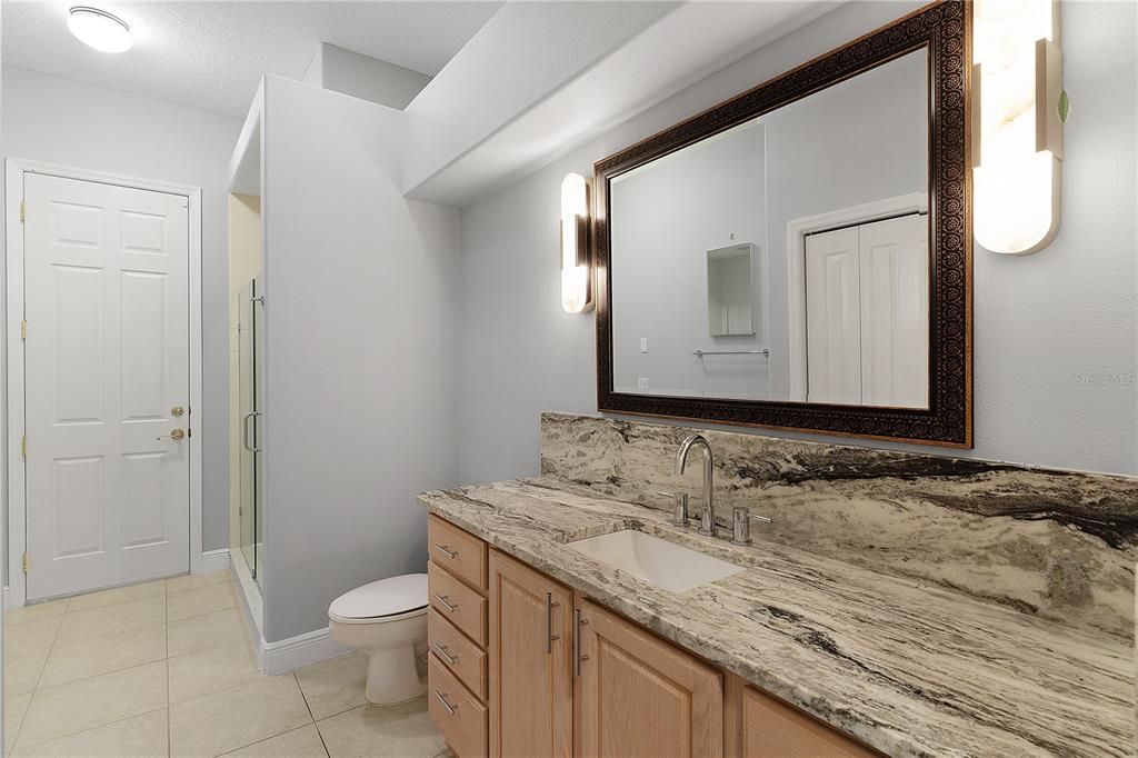 Guest Bathroom with Entrance to the Pool Area
