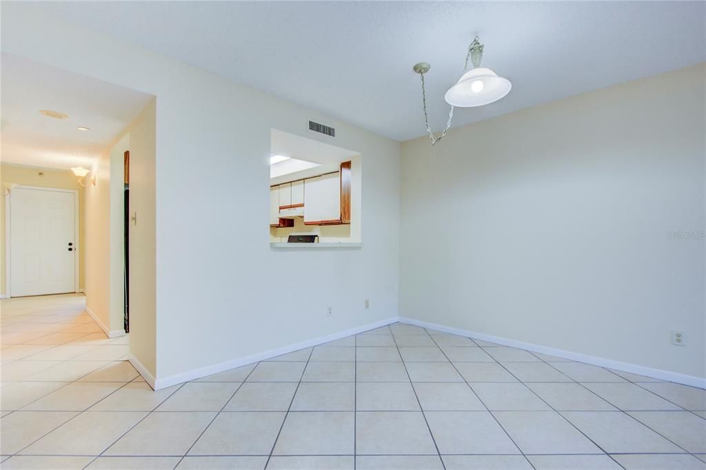 formal dining room off living room looking at pass through to kitchen