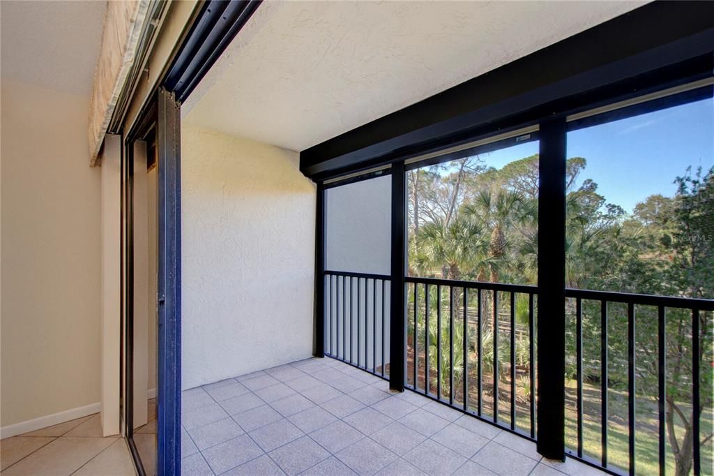 outdoor view and view of balcony and storm shutters