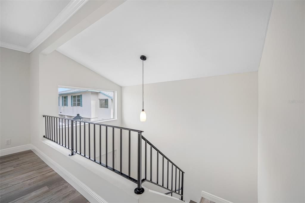 Wonderful High Ceiling at Entry Foyer with new Ceiling Pendant and Lots of Natural Light
