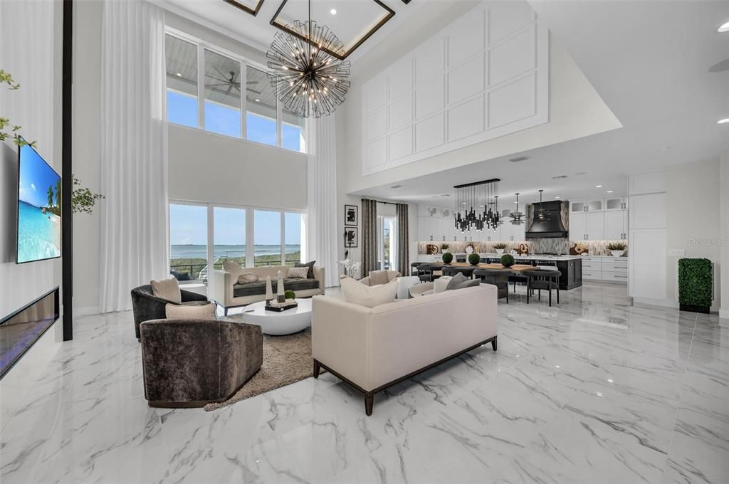 The expansive great room with stunning views of the Sarasota Bay is perfect for entertaining!