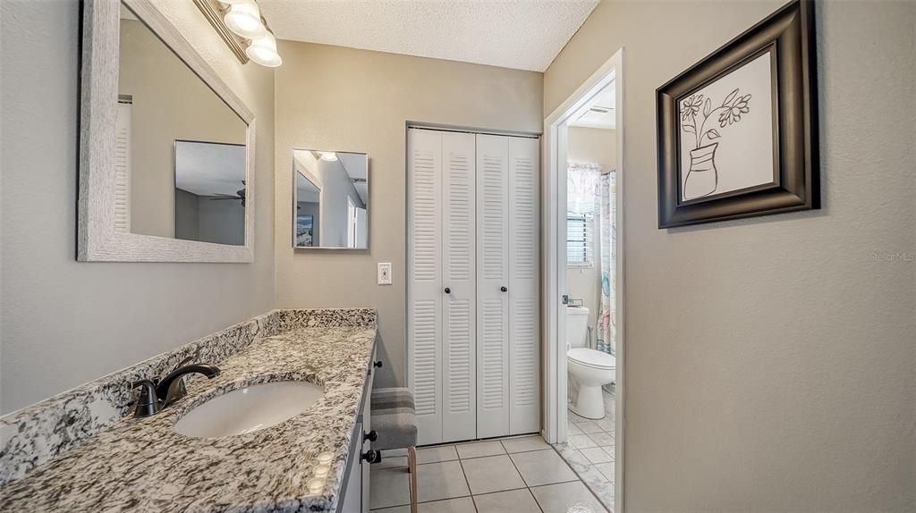 The updated single vanity has a boudoir area and a linen closet.