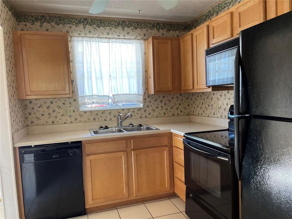 Kitchen with Black Appliance Package (9X8)