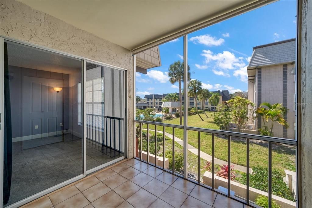 Enjoy the view from your screened patio with access from living room and bedroom