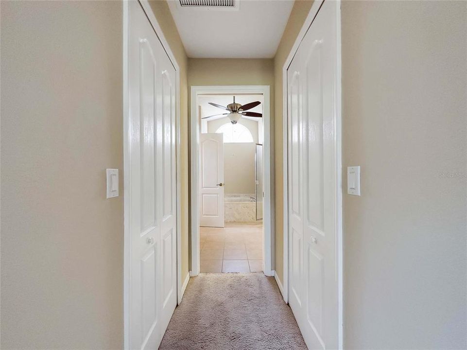 his & hers walk-in closets leading to Ensuite