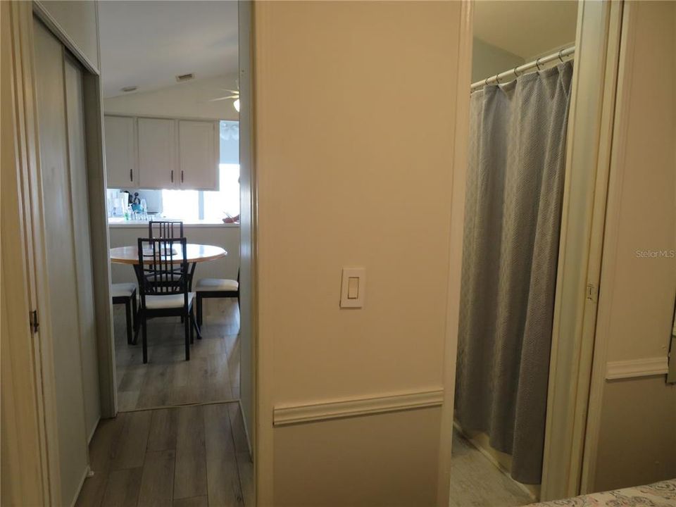 Hallway leading from bedroom to family bathroom and dining area, also provides additional storage space