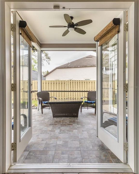 Frenchdoors open to the pool area from the master bedroom