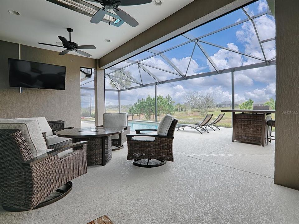 GREAT OUTDOOR LIVING SPACE.  REMOTE SHADES CREATE A COZY ROOM FOR OUTDOOR LIVING.