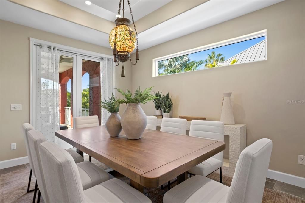 Dining room with natural light and doors to balcony