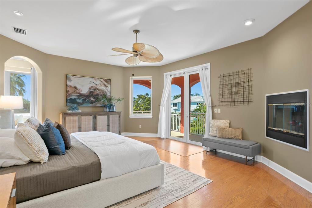 Primary Bedroom with double sided wood burning fireplace