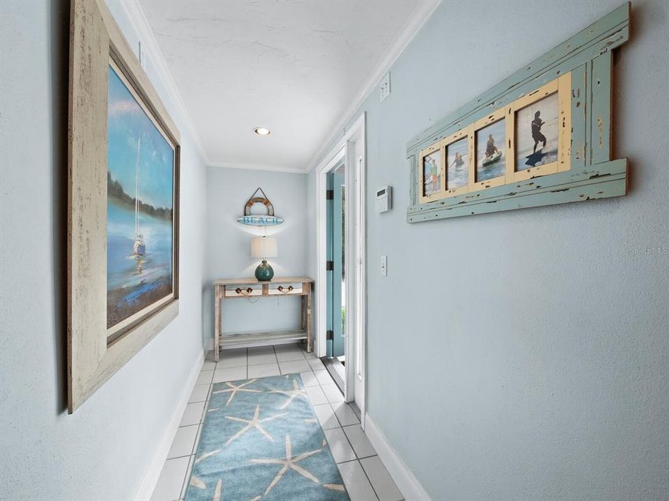 A hallway of welcome: step into your home and experience the warmth of your inviting foyer.