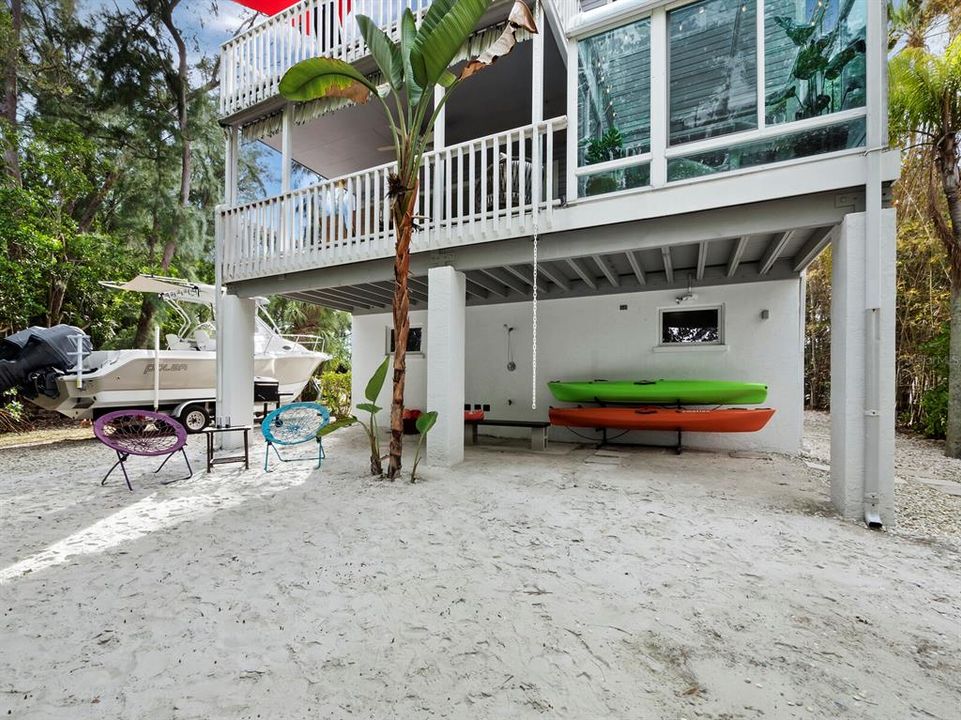 Designed for coastal living - get a closer look at the back of your home, where beneath the second-floor balcony, a covered outdoor shower and kayak storage enhances the seaside experience.