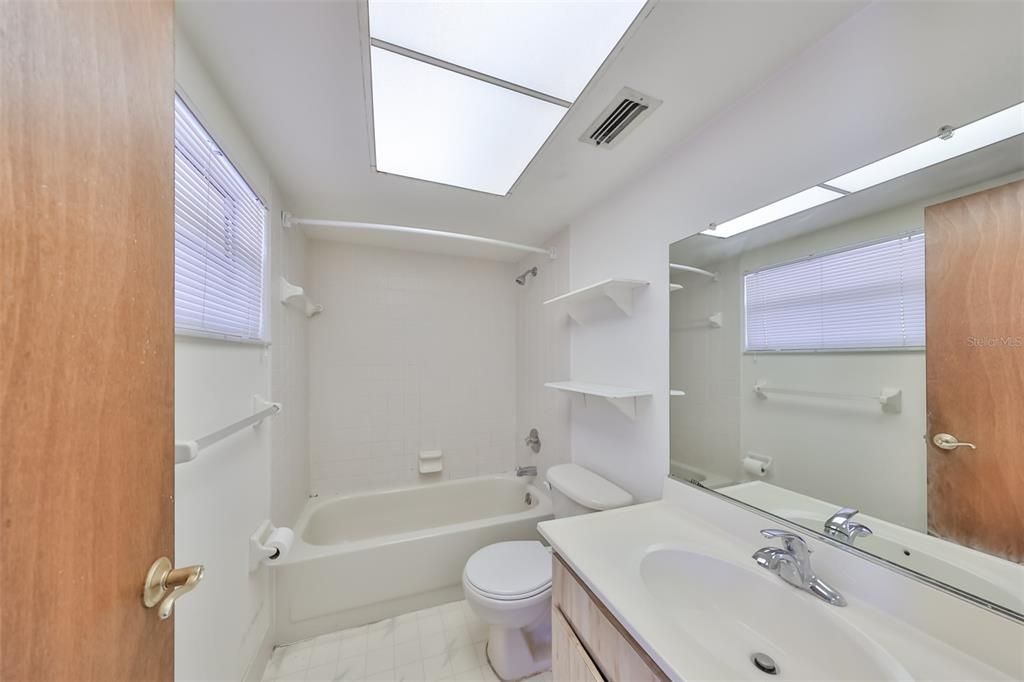 Photo of bathroom with tub and shower.