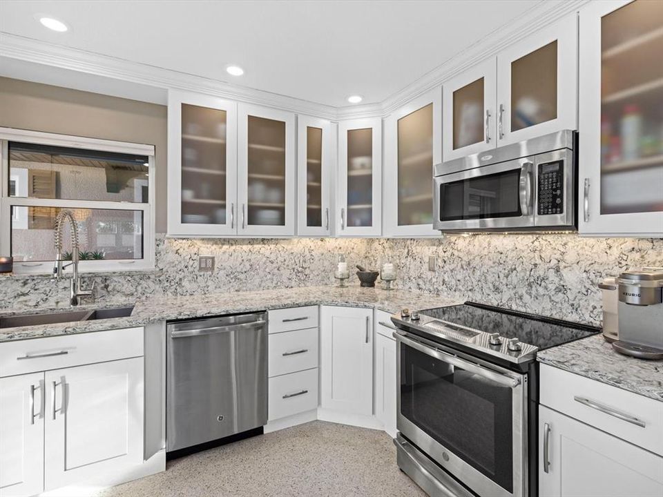Kitchen with quartz countertops, stainless steel appliances