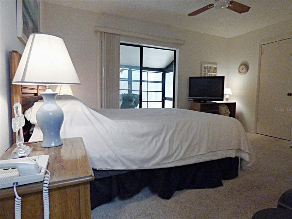 Master Bedroom with Sliders to Side Lanai