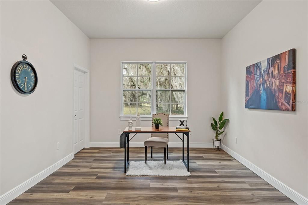 bedroom 2 featuring luxury vinyl floors