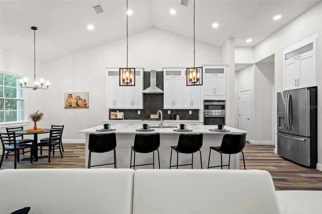 Sleek and sophisticated Kitchen with eat in space and island.