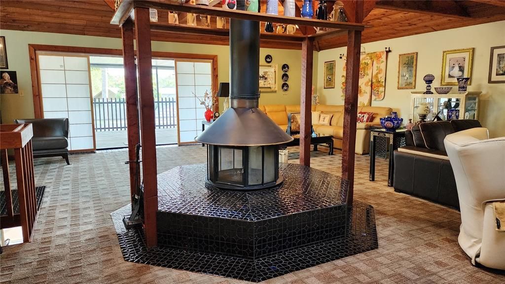 Enjoy those cool Florida evenings around this center woodburning fireplace in the upstairs family room.