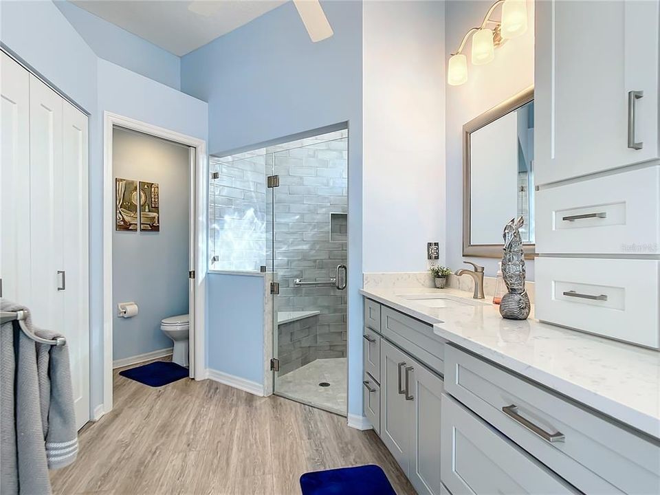 dual sinks in main bath w/water closet and walk-in shower