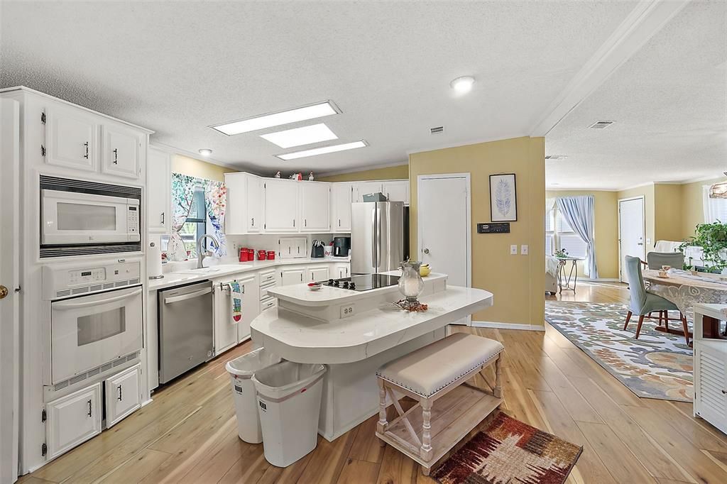 Kitchen opens to dining area